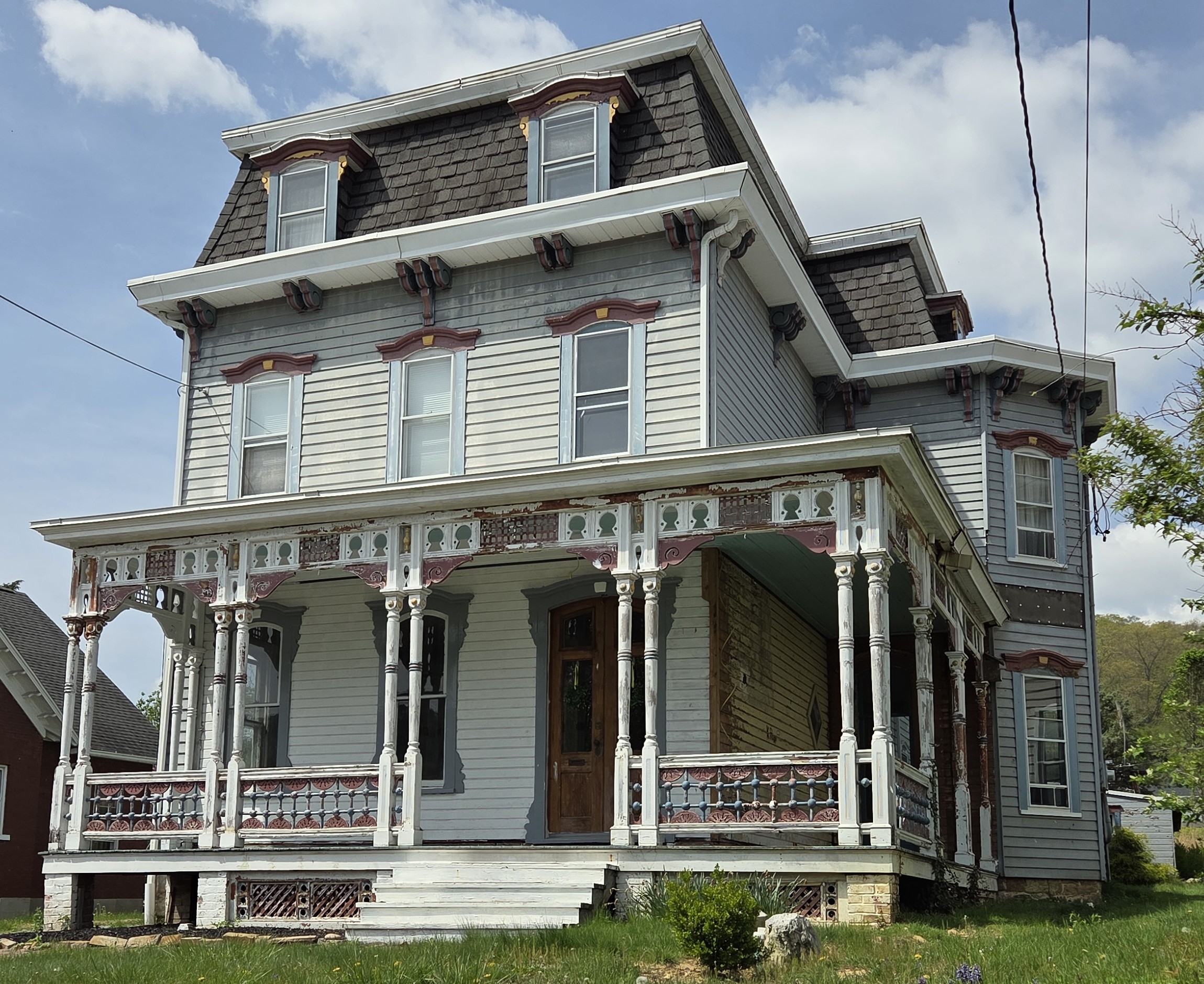Victorian home with ornate porch and gabled roof