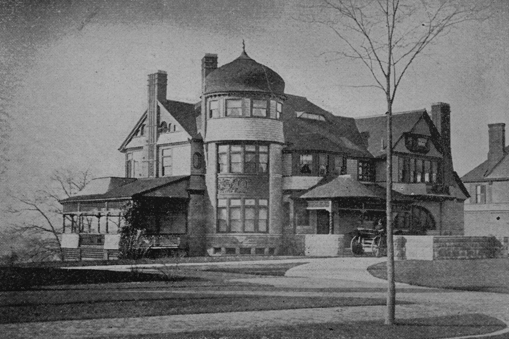 Victorian home with turret, wrap-around porch, and ornate woodwork.