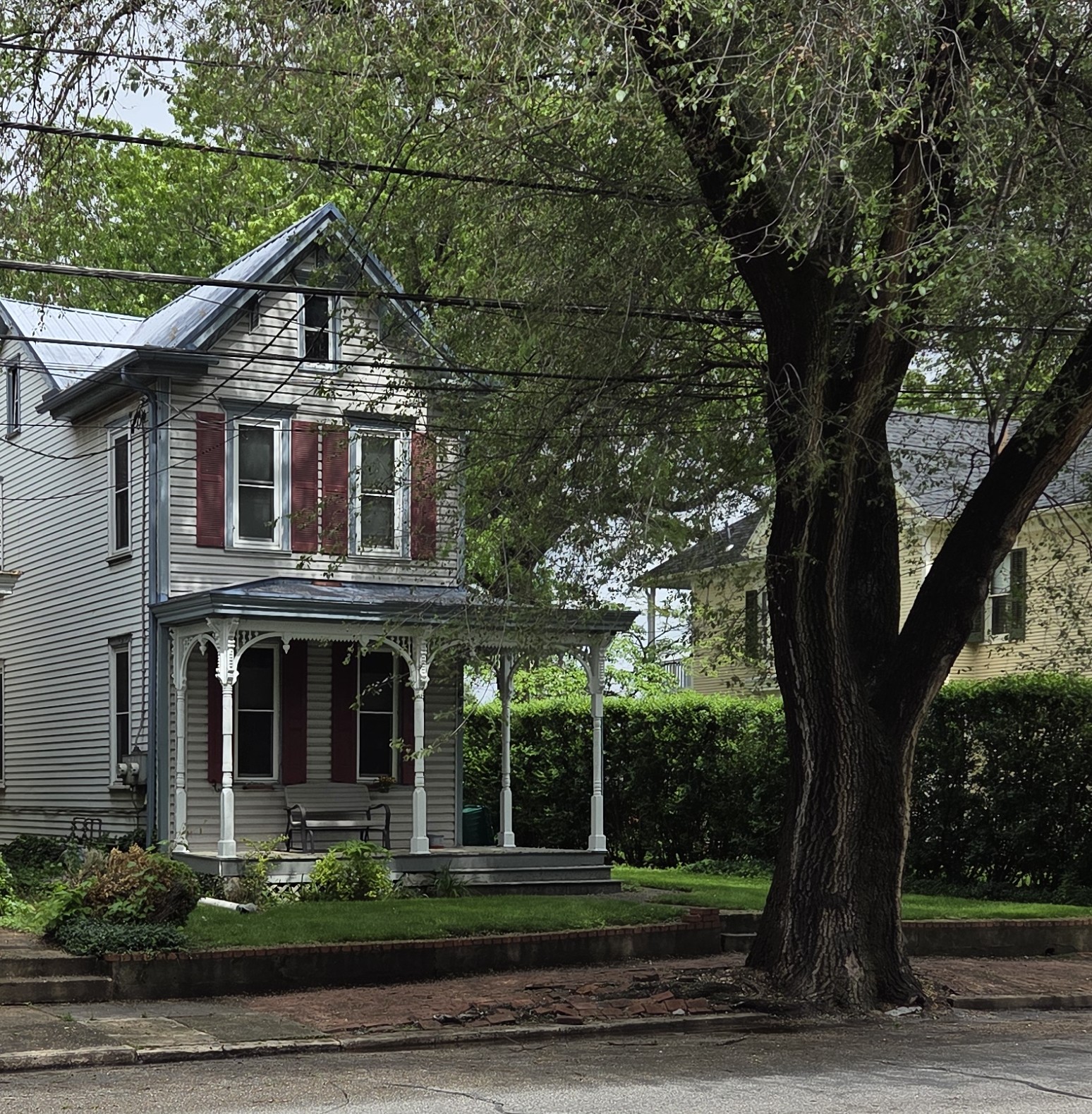 Victorian home with a wrap-around porch and decorative trim